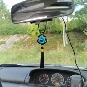 car pendant with blue crochet flower and black tassel