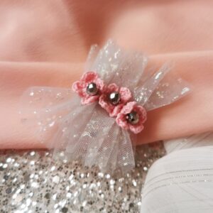 brooch with pink crochet flowers and grey tulle