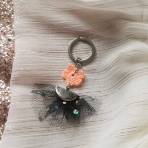 keychain with orange crochet flower and black tulle tassel
